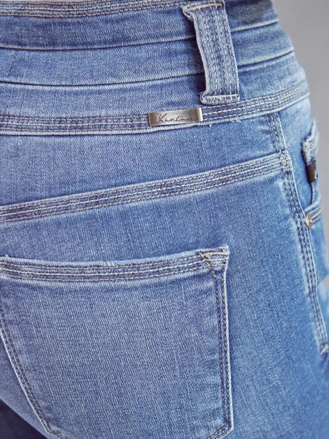 The Skinny Triple Button Kancan Jeans