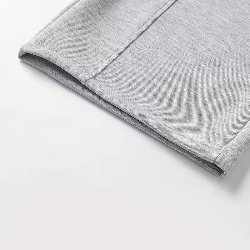 Men's unisex wide-leg sweatpants, loose and breathable polyester casual trousers with drawstring design, and solid color paneling