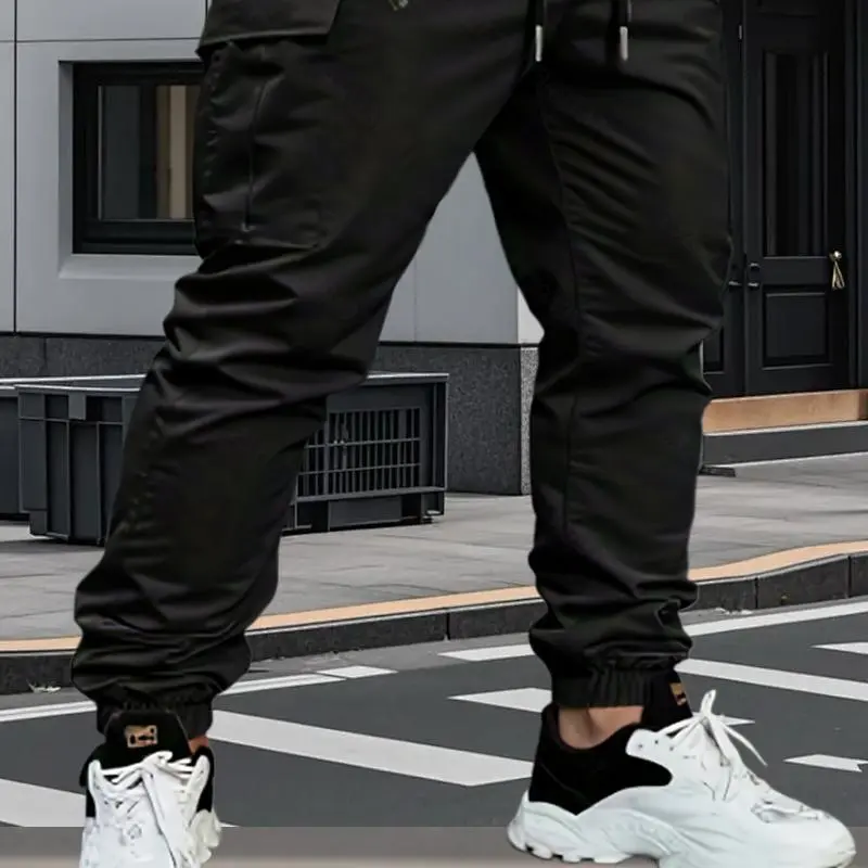Men's work pants with tapered legs and rolled-up cuffs