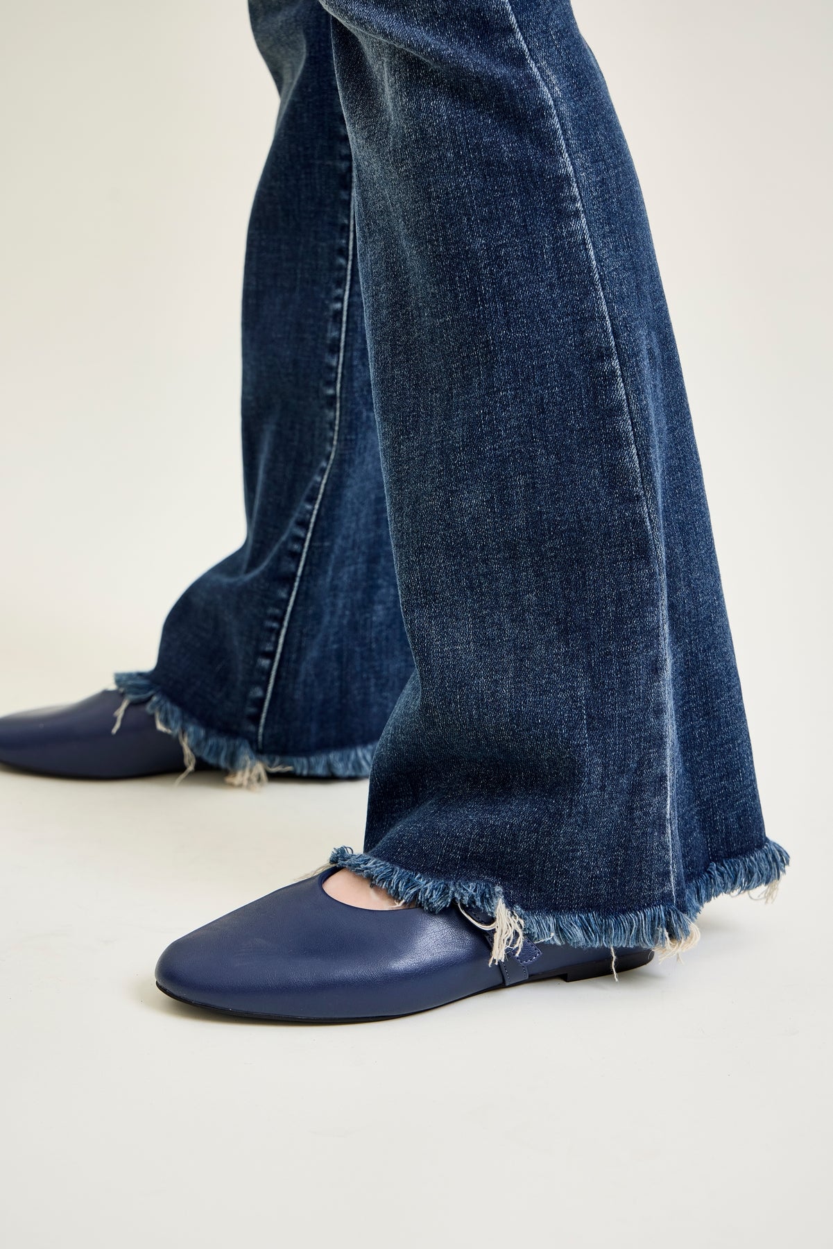 Amanda Mid Rise Flare Jeans with Distressed Knee & Frayed Hem