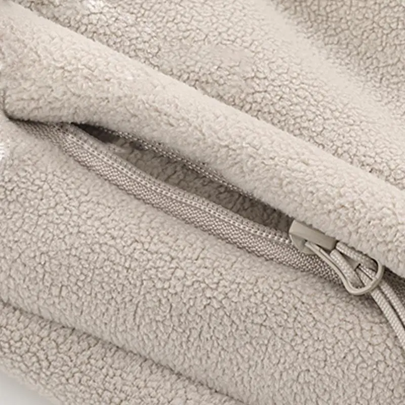 Unisex fleece-lined sweatpants with brushed interior, flat front design, zippered pockets, and a relaxed fit