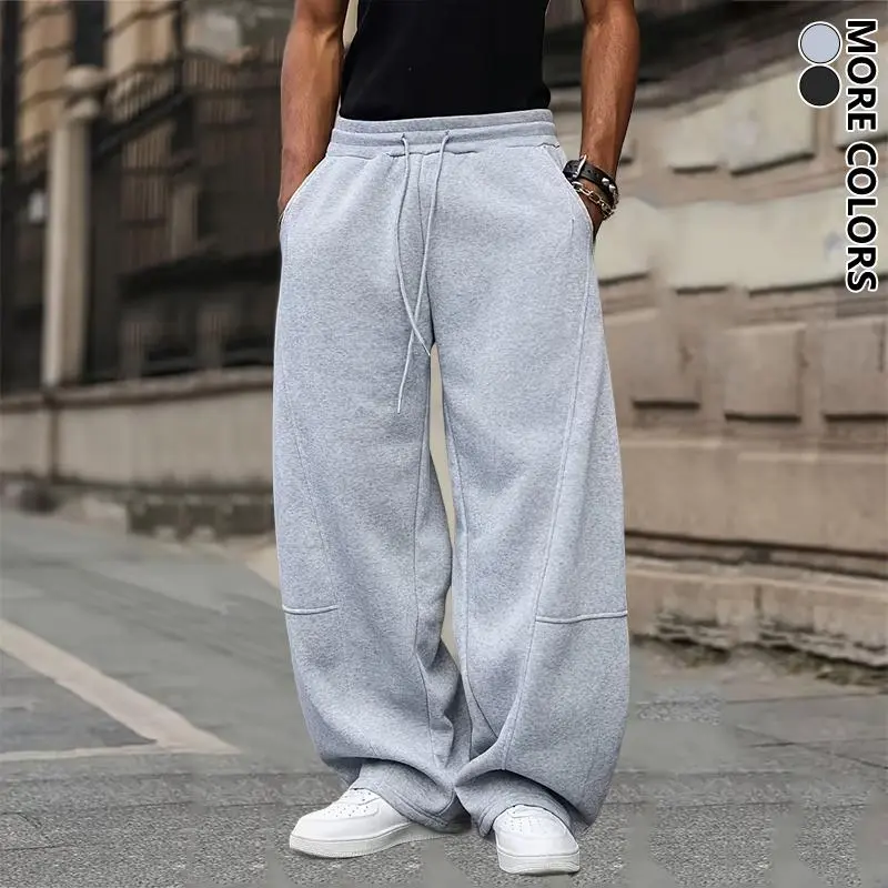 Men's unisex wide-leg sweatpants, loose and breathable polyester casual trousers with drawstring design, and solid color paneling