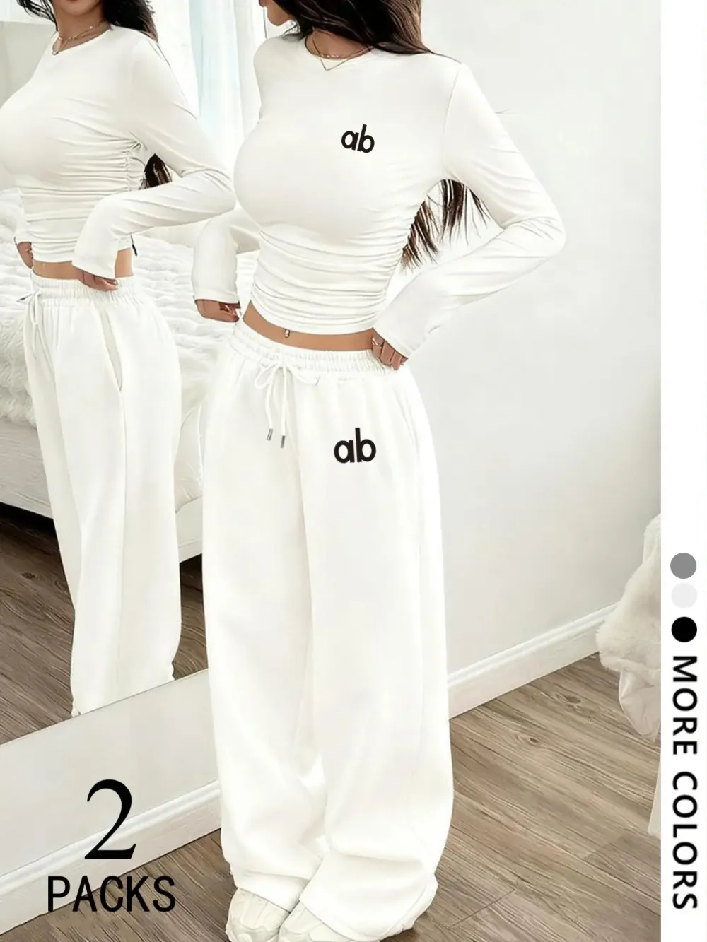 Women's two-piece set: a casual, loose-fitting long-sleeved top paired with straight-leg trousers.